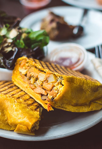 Caribbean-inspired cuisine at CBRYZ Resort’s beachfront restaurant featuring locally crafted dishes and fresh ingredients.