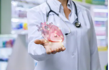 Doctor holding heart.