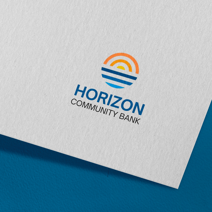 Horizon Community Bank logo design on white paper with a blue background.