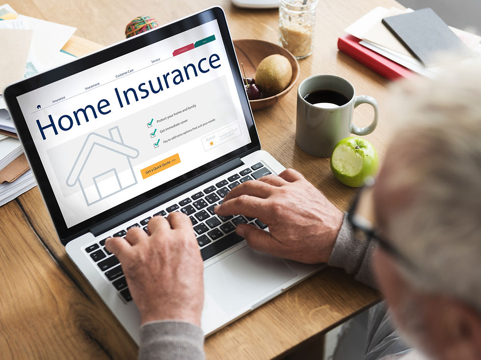 Man using laptop showing "Home Insurance" website concept for homeowners.