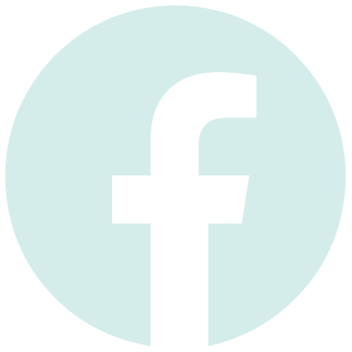 Facebook logo in a small white circle. Clicking this links to Marjuan Canady's Facebook profile. 
