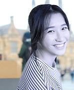 Smiling Student Sitting At Desk_edited_e
