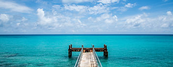 Rusty dock at Bermuda beach.jpg