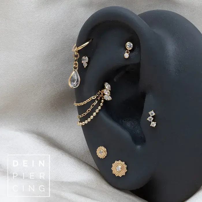 Curated Ear mit Piercingschmuck aus Gelbgold