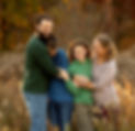 Family portrait of man, woman, boy, and girl