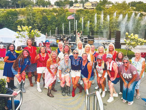 Flash mob of local line dancers perform during Branson Landing Summer Concert series