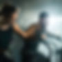 happy-female-athlete-cycling-exercise-bike-cross-training-health-club_edited.jpg