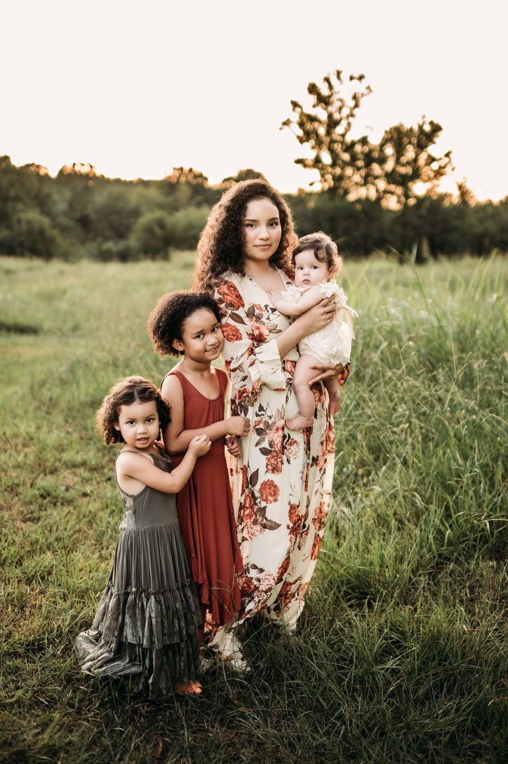 Mother and her three beautiful girls at Fisher Farm Park in Charlotte, North Carolina