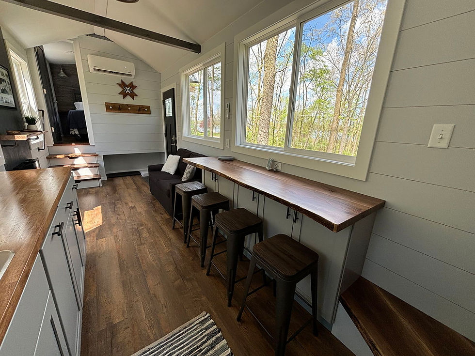 Thumbnail: This 38' fifth wheel tiny home features an expansive bedroom and a generous kitc