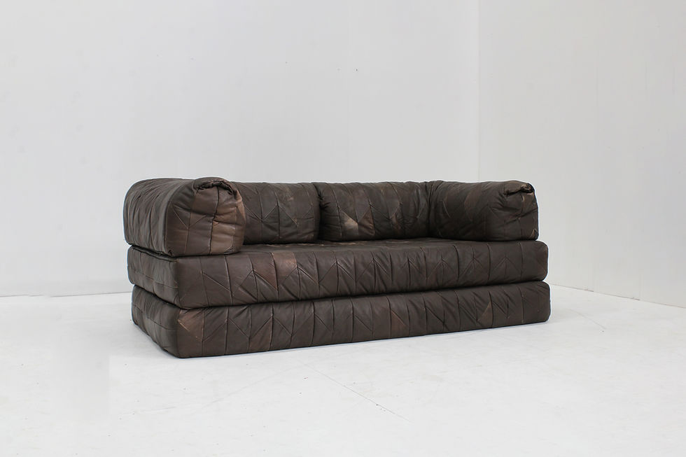 Thumbnail: Vintage 1970s leather patchwork sofa with a bold, sculptural design.