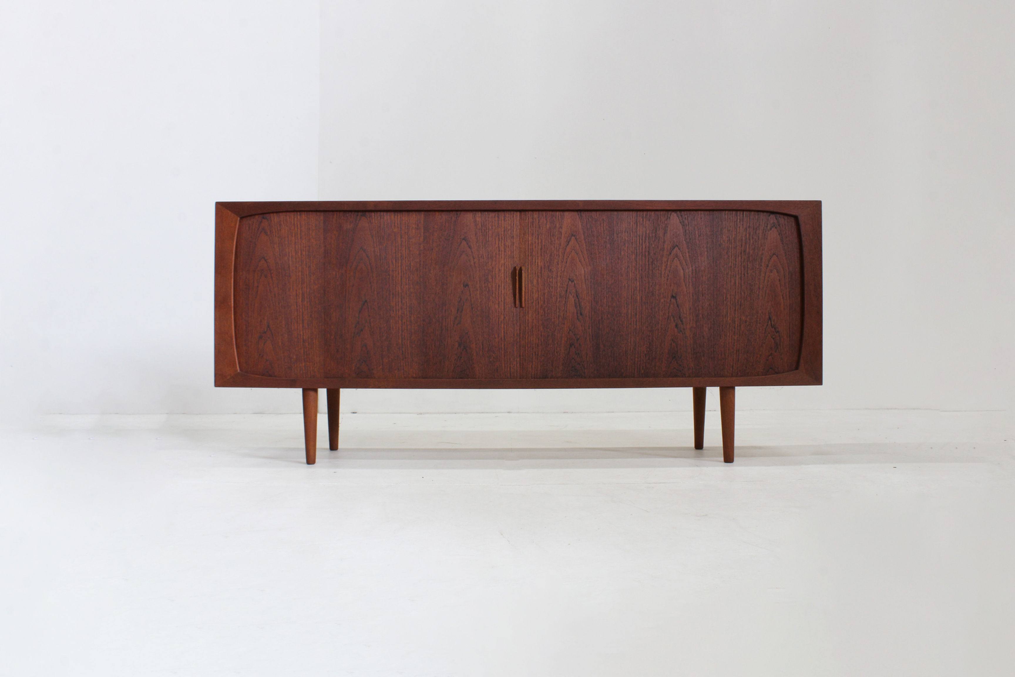 Vintage mid-century sideboard from the 1960s with sliding doors. The sideboard originates from Denmark, dating from the 1960s