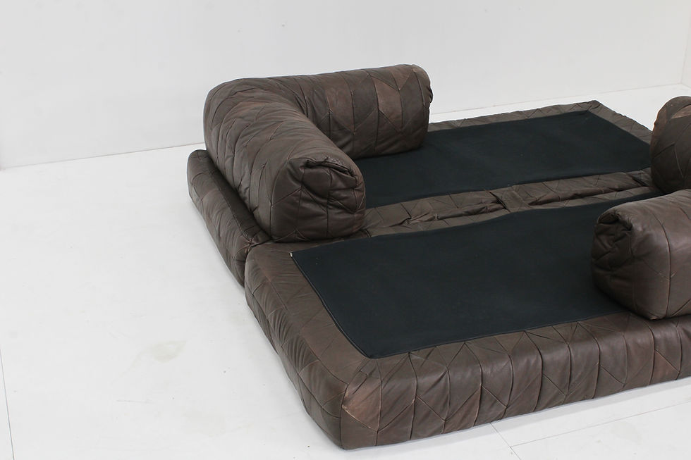 Thumbnail: Vintage 1970s leather patchwork sofa with a bold, sculptural design.
