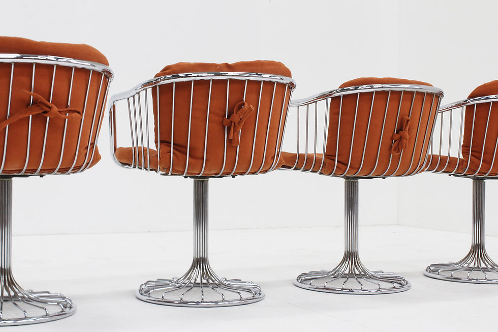 Thumbnail: Set of 4 vintage swivel dining room chairs with chrome frame and orange fabric upholstery.