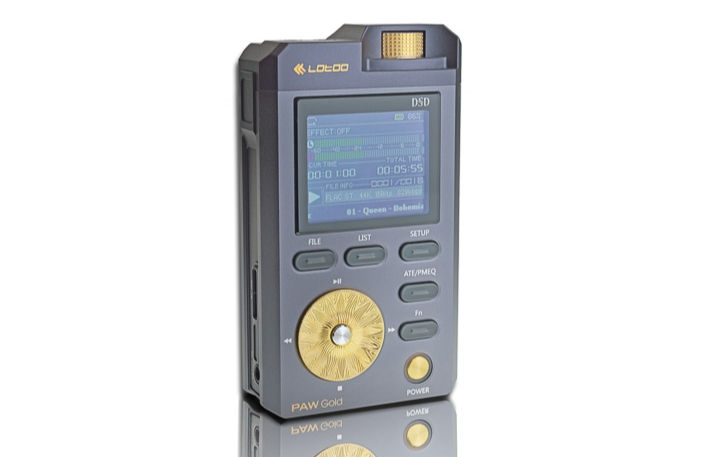 Portable audio player with gold accents displays a music track. Buttons and screen show "DSD" and "PAW Gold." Reflective surface.