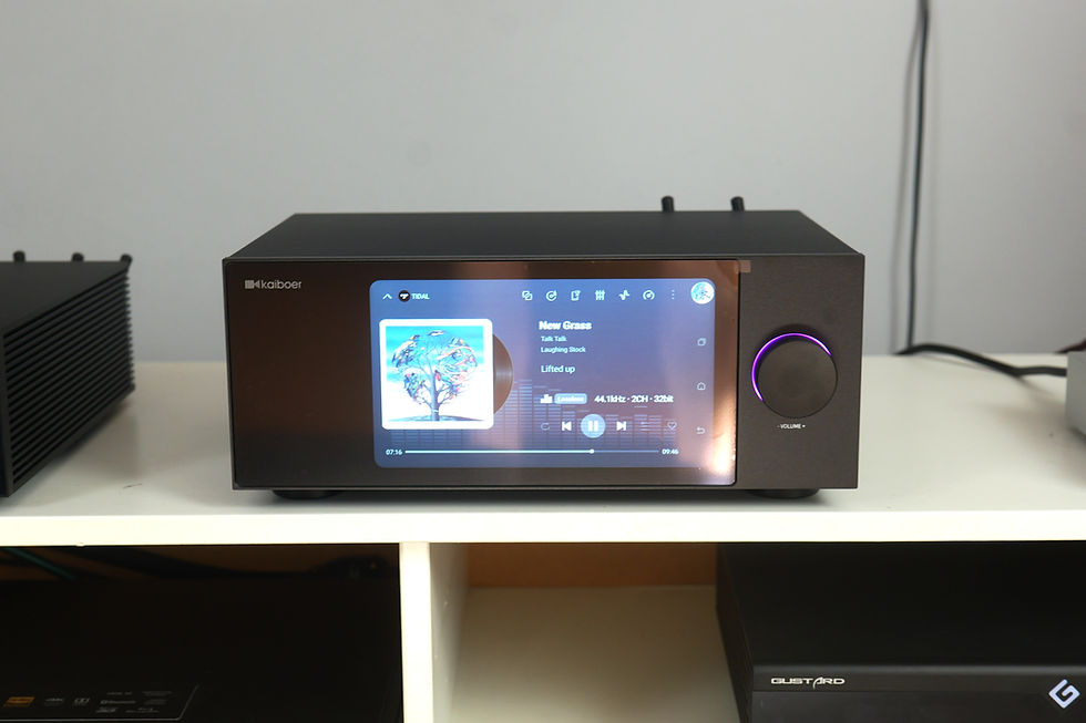 Black Kaiboer music player on white shelf displays TIDAL album art and song New Grass; purple volume ring glows.