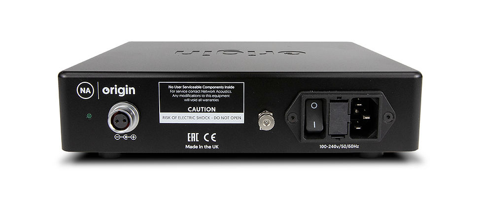 Black electronic device with ports and a power switch on the back. Labels include "NA origin" and safety warnings. Made in the UK.