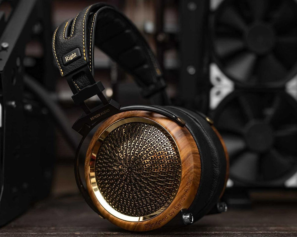 Ornate headphones with wood and gold accents on a table, marked with "Right". Background shows tech components, creating a modern vibe.