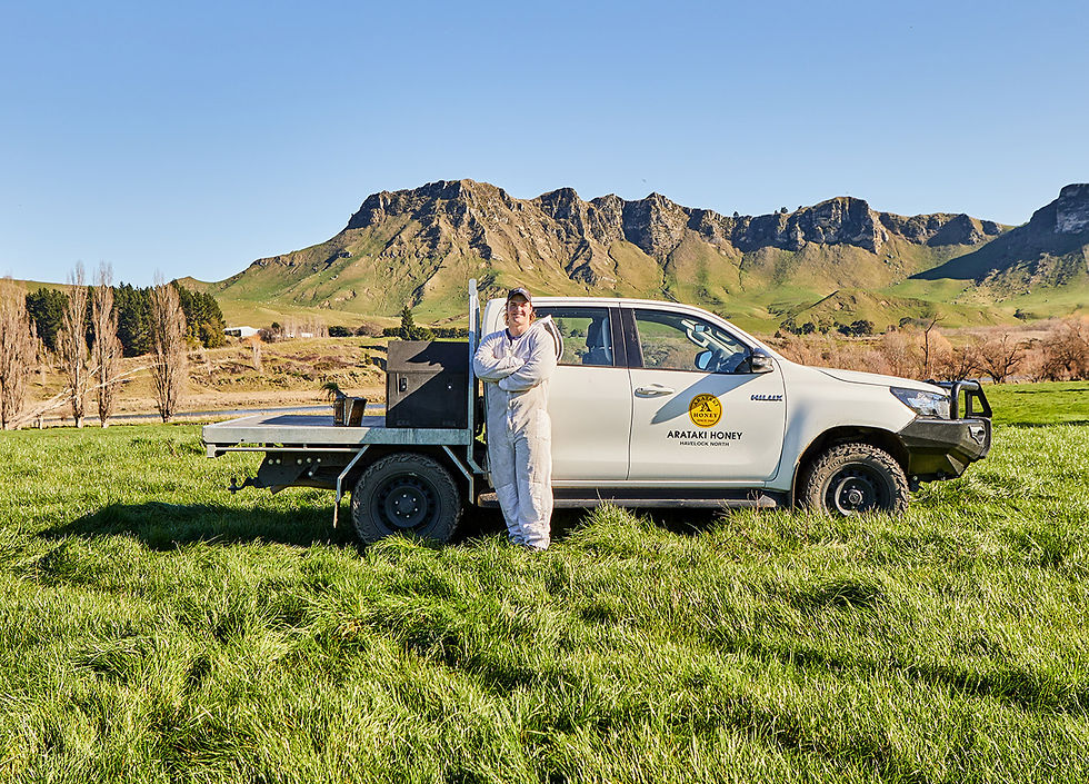 Beekeeper Joseph next to his Arataki Truck