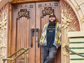 Man standing in front of art deco building