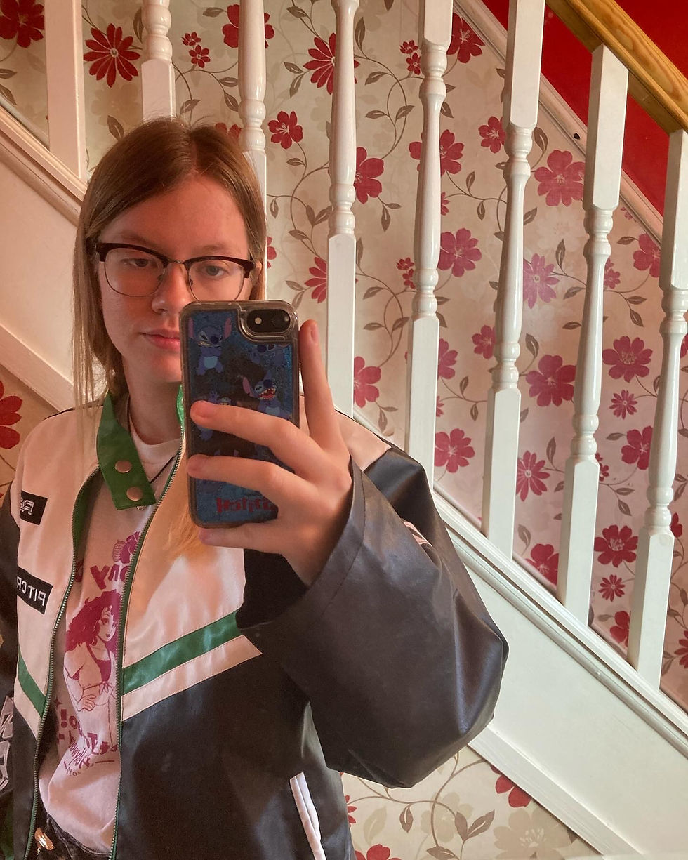 A mirror selfie of CEO and artist Nicole Porter.
