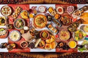 A table adorned with a variety of appetizers and desserts, showcasing a culinary journey from start to finish.