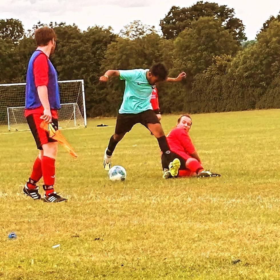 Ralph (middle) playing football for a local Leicester side