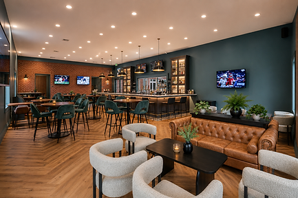 Modern bar interior with leather sofas and bar seating.