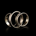 Wide metal rings on black background.jpg