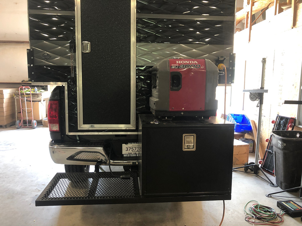 Custom built metal box for a generator on the back of a truck