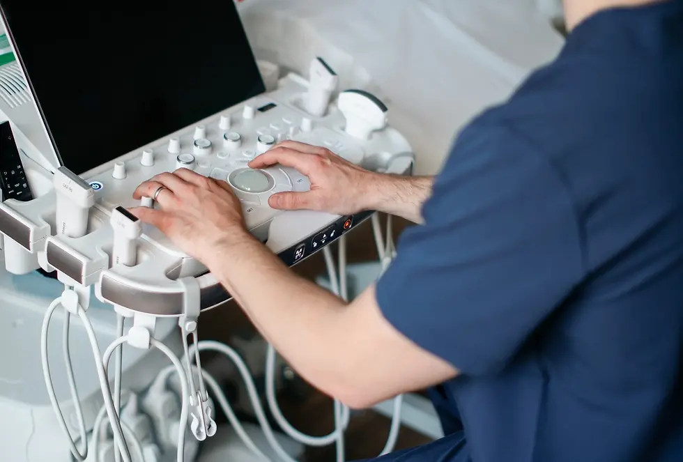 Medical professional operating an ultrasound machine