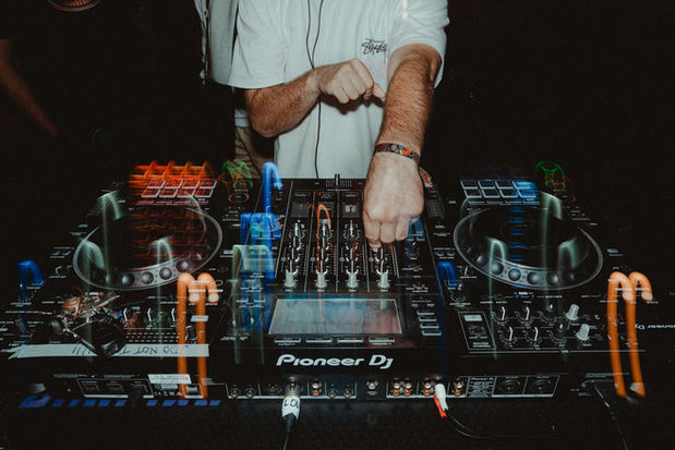 DJ's hands on Pioneer DJ console