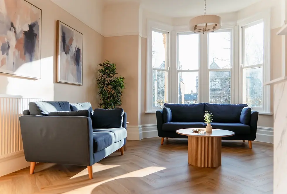Bright living room with blue sofas and coffee table