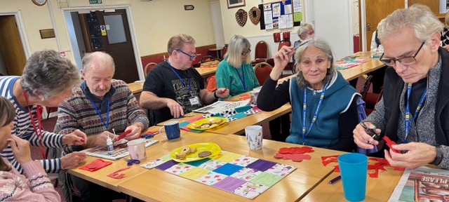 A Memory Group sat at a table doing crafts