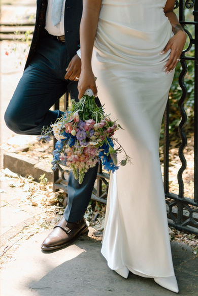 Wedding couple holding a colorful bouquet