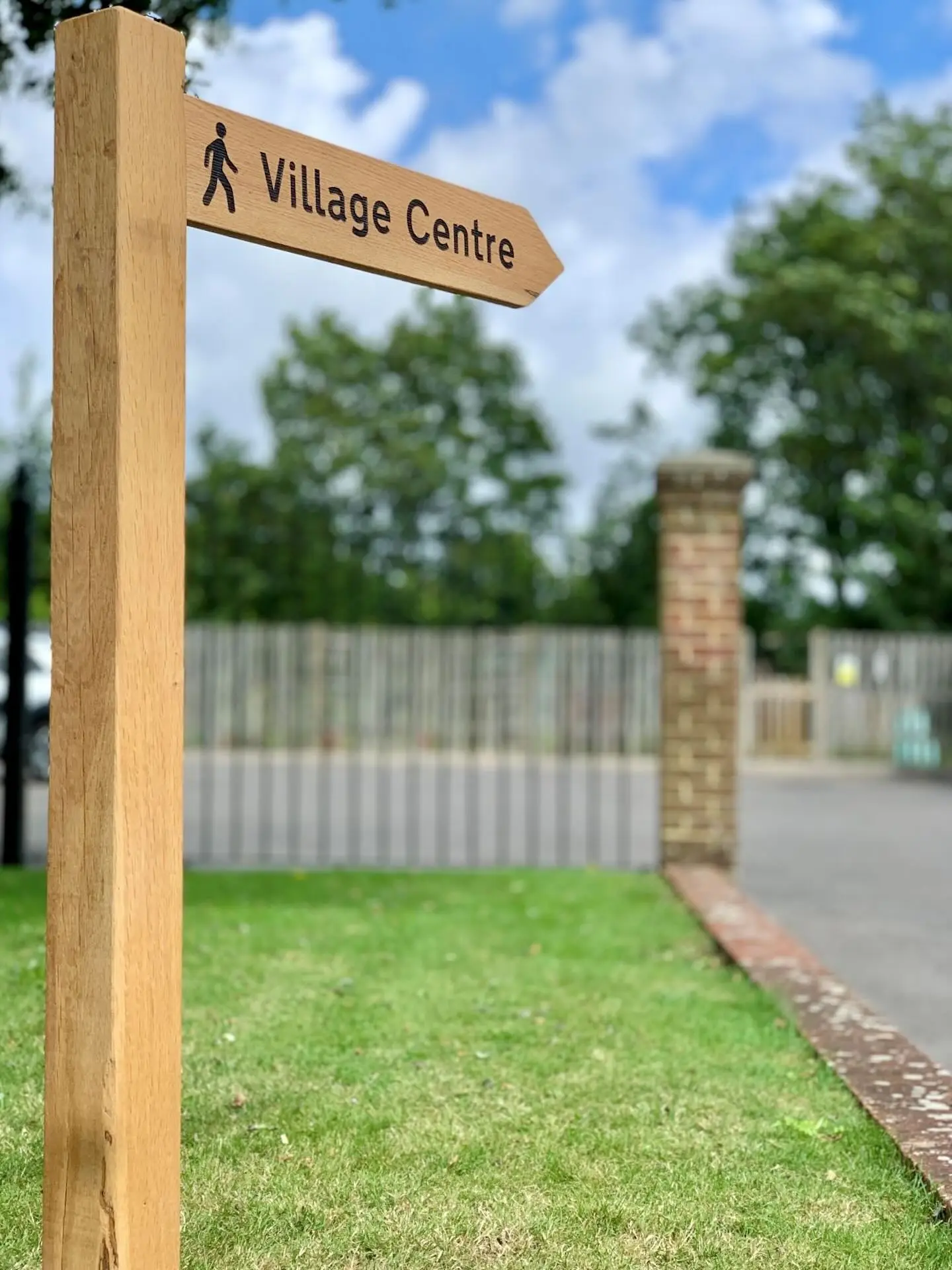 Signpost pointing towards the village centre