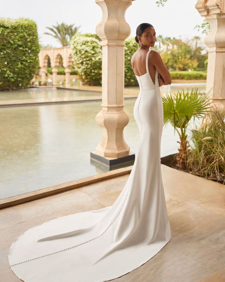 Model in elegant white mermaid wedding gown