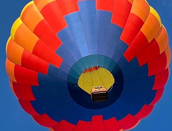 Hot air ballon over Auburn in red, orange and blue colors