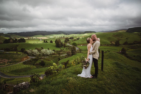 Sweeping valley views, wide open skies for elopements near Raglan, New Zealand. Lena Mc Killop Photography
