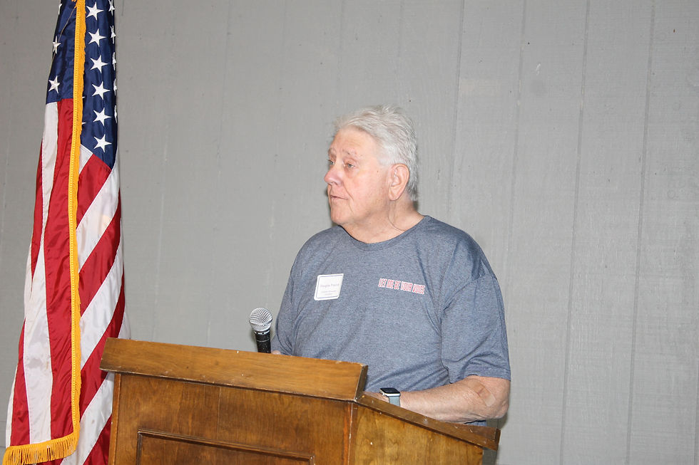 Running for Winchester City Council, Doug Freund, speaks to community members at the Candidate Forum held at the Red Roof Pavilion on July 17th.