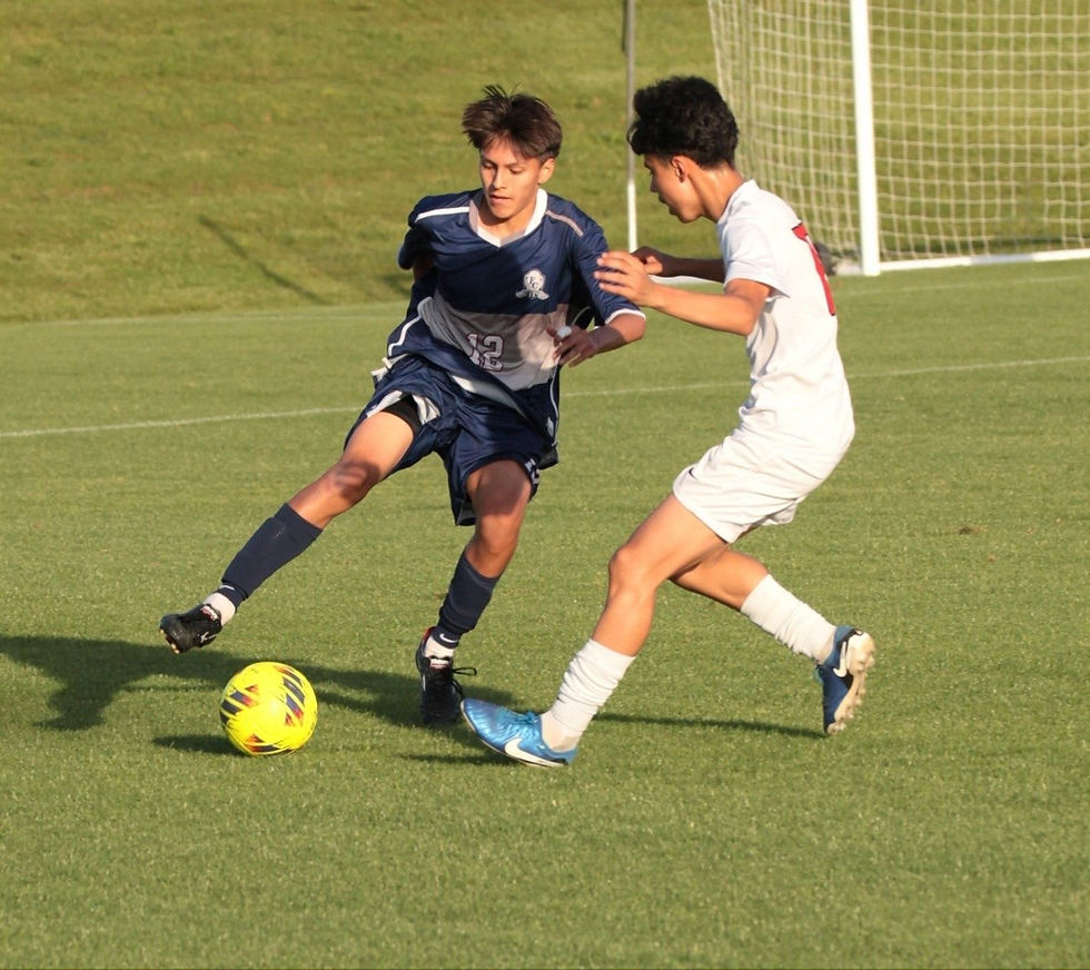 Gio Mendez demonstrates his elite skills on the soccer field, expertly maneuvering past a defender.