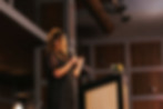 Brianca in a meeting setting, leading a group of women through her framework