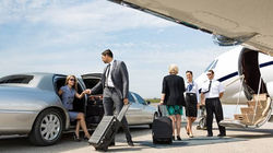 Airport limo service in Washington DC with luxury chauffeur providing airport transfers to DCA, IAD,