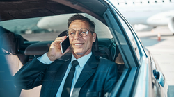 Airport limo service in Washington DC with luxury chauffeur providing airport transportation to DCA,