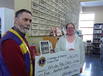 News 12 Donation to Large Print Prog.jpg