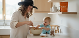 Woman and baby mixing together a bowl in a kitchen setting with Beliver pouch on the counter.