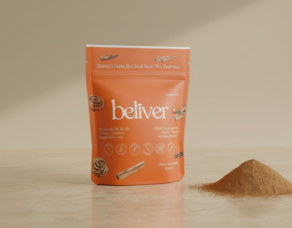 Orange BeLiver™ powder package and pile of BeLiverpowder on white surface.