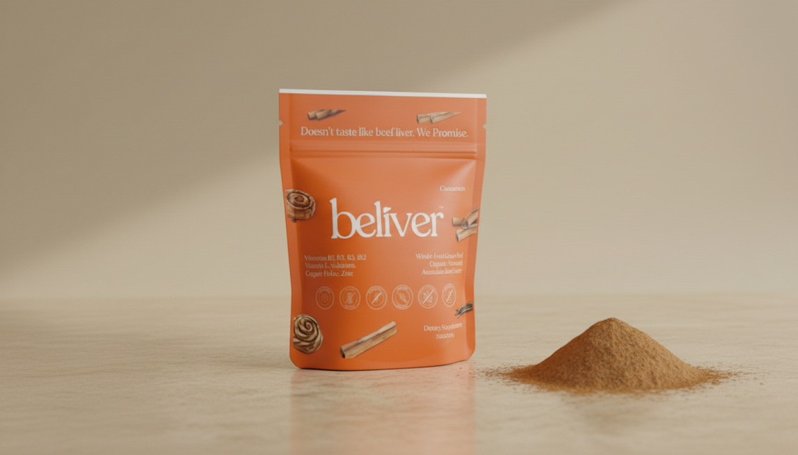 Orange BeLiver™ powder package and pile of BeLiverpowder on white surface.