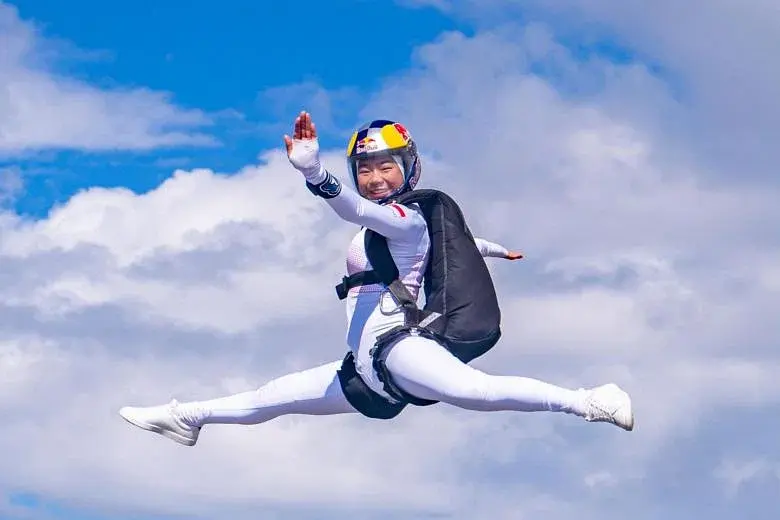 Red Bull Athlete and World Champion Indoor Skydiver, Kyra Poh, skydives in Spain, showing the world how she went From the Tunnel to the Skies