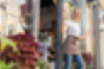 Small business owner standing outside of her flower shop
