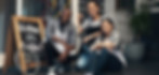 Small business startup owners sitting in front of shop open for business